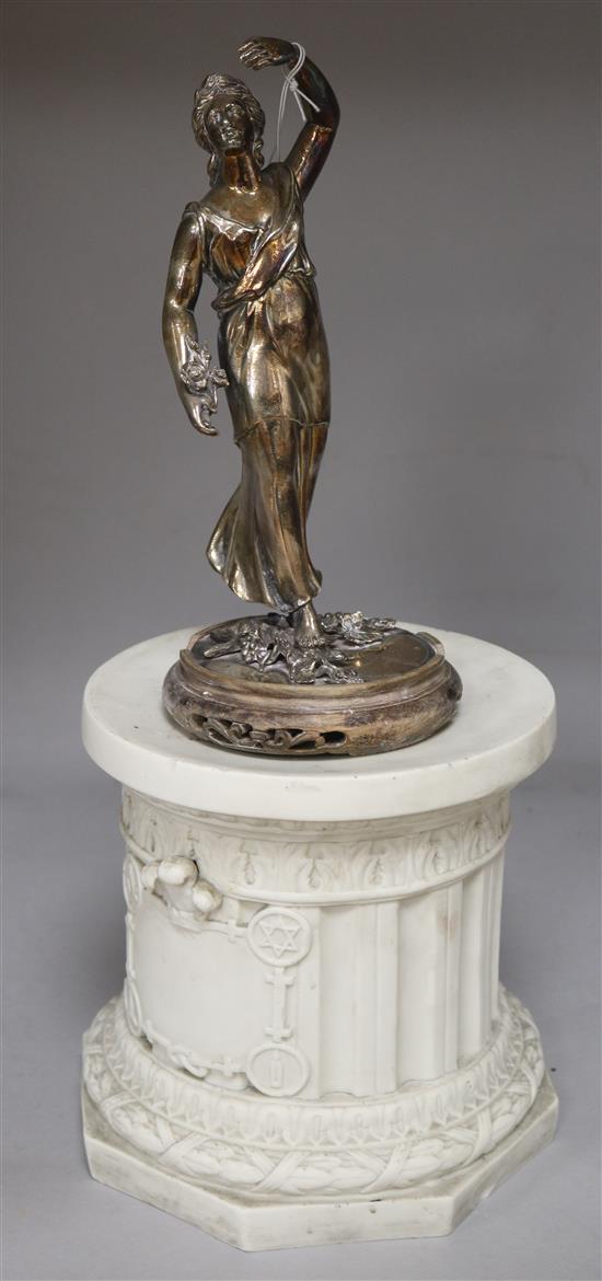 A silvered metal figure of a Roman goddess